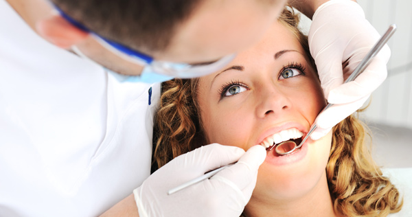 a lady is having general dentistry treatment