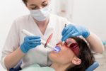 a female is getting cosmetic dentistry treatment