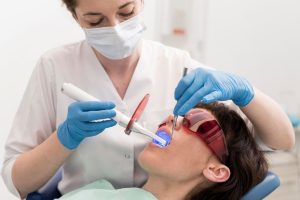 a female is getting cosmetic dentistry treatment
